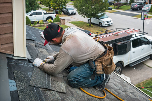 Professional Roof Replacement technician working in Marion, ND